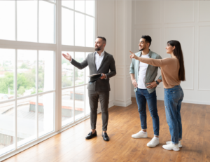 This is an image of an agent showing a home to buyers.