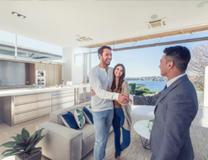 This is an image of a couple listing their home with an agent.
