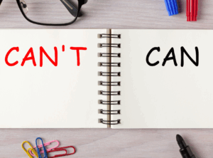 This is an image of a notebook with the word can't written in red on one side and can written in black on the other side.