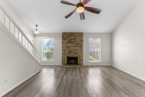Living room with vaulted ceiling and brickfireplace at 2100 Kippling Drive #128